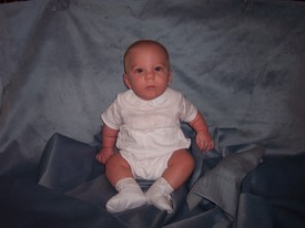 Tue Oct 11 12:56:34 2005

Mommy took a stab at photography.  A little blue-grey velvet and some blocks to hold me up, and looks like she didn't do too badly, huh?