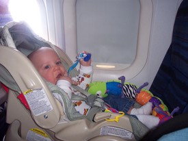 Sun Jan 22 11:34:56 2006

This is a shot of Andrew's 2nd plane ride, the return flight from our trip to Dearborn, MI, for Great Grandpa Andy's memorial service.  We were seating in the very back of a NWA DC-9 on both flights.