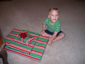 Fri 25 Apr 2008 08:13:41 AM

Andrew opened his gifts from Mom and Dad on the morning of his birthday, right before dad went to work.  The party, and gifts from others, followed the next day.