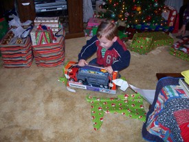 Tue 30 Dec 2008 10:50:58 PM

Not only was Andrew (Ellen and Lester) sick with a bad head-cold, but Papa's passing on 01/02/09 delayed Christmas with Lester's side of the family until sometime later in 2009.  We did let Andrew open a few gifts, however.