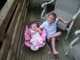 Sat 01 Aug 2009 09:44:35 AM

Andrew and Gracie on the deck at the house we rented in Beech Mountain, NC for the week.