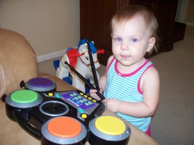 Fri 25 Jun 2010 02:49:25 PM

Gracie plays Andrew's toy drums.