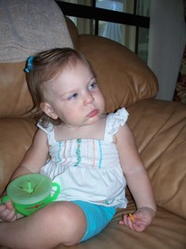 Thu 23 Sep 2010 09:05:09 AM

Not sure what Gracie is doing here (other than eating a snack), but based on the date/time she's probably watching the Mickey Mouse Clubhouse.